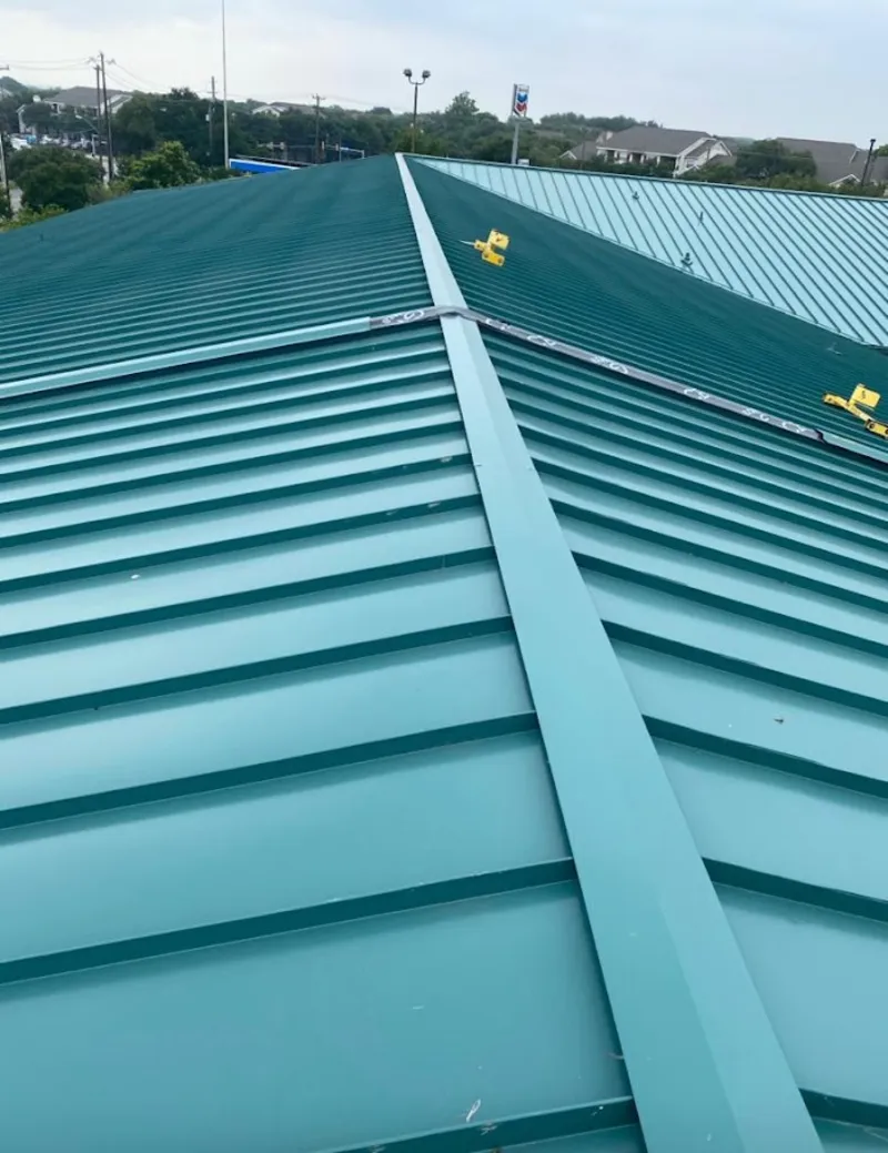 Green commercial metal roof ridge and valley for Metal Roof Repair in Parsons